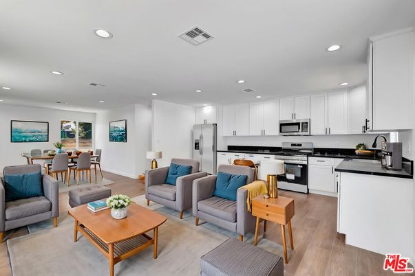 Dining room, Interior, Kitchen, Living room, Recessed Lighting, Stainless Steel Appliances, Wood Texture Flooring
