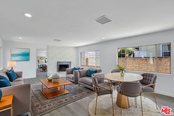 Dining room, Fireplace, Interior, Living room, Recessed Lighting, Wood Texture Flooring
