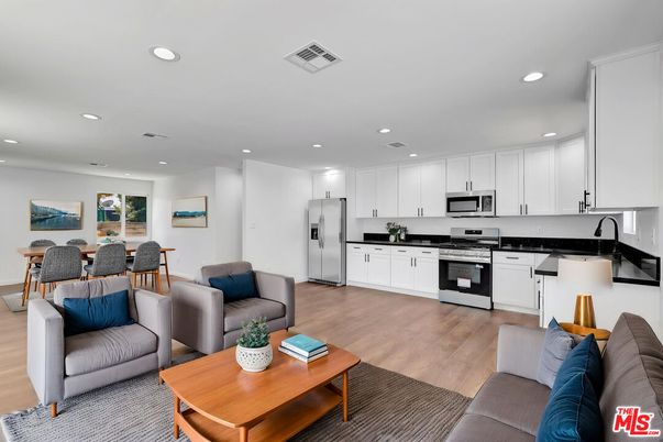 Dining room, Interior, Kitchen, Living room, Recessed Lighting, Stainless Steel Appliances, Wood Texture Flooring