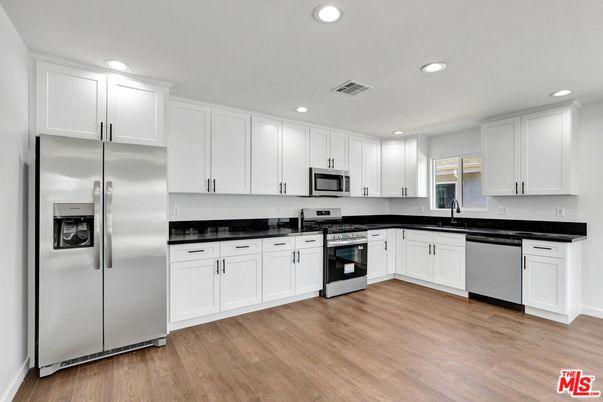 Interior, Kitchen, Recessed Lighting, Stainless Steel Appliances, Wood Texture Flooring