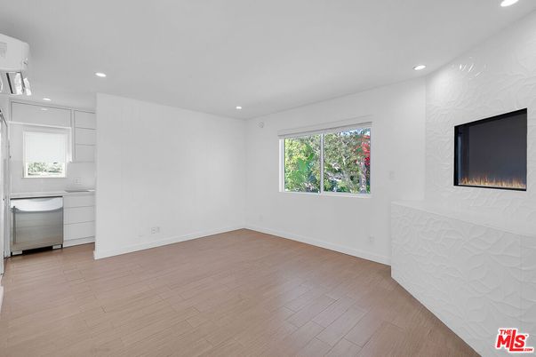 Empty room, Fireplace, Interior, Kitchen, Recessed Lighting, Wood Texture Flooring