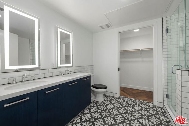 Bathroom, Dual Sink Vanities, Glass Shower, Interior, Recessed Lighting, Wood Texture Flooring