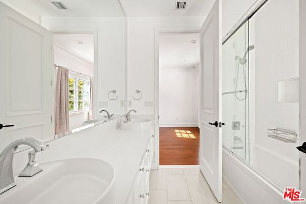 Bathroom, Dual Sink Vanities, Glass Shower, Interior, Marble, Wood Texture Flooring