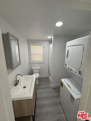 Bathroom, Interior, Recessed Lighting, Utility Closets, Washer, Wood Texture Flooring