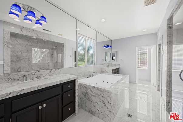 Bathroom, Dual Sink Vanities, Glass Shower, Interior, Marble, Marble Walls, Recessed Lighting