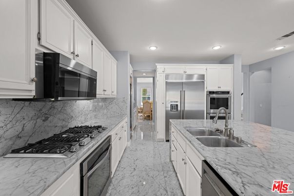Interior, Kitchen, Marble, Marble Walls, Recessed Lighting, Stainless Steel Appliances