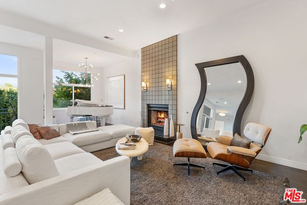 Chandelier, Fireplace, Interior, Living room, Pendant Lights, Piano, Recessed Lighting, Wood Texture Flooring
