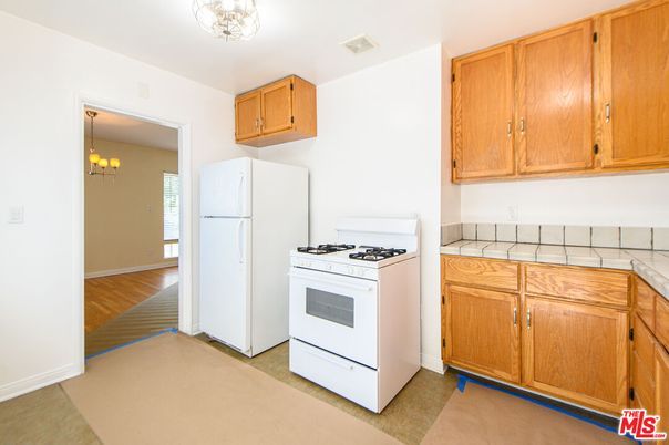 Chandelier, Interior, Kitchen, Pendant Lights, Tile Countertops, Wood Texture Flooring