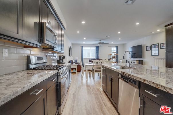 Dining room, Interior, Kitchen, Recessed Lighting, Stainless Steel Appliances, Wood Texture Flooring