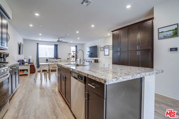 Dining room, Interior, Kitchen, Recessed Lighting, Stainless Steel Appliances, Wood Texture Flooring
