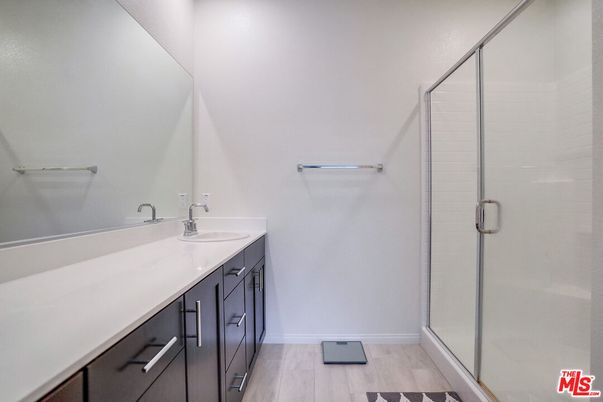 Bathroom, Dual Sink Vanities, Glass Shower, Interior, Wood Texture Flooring