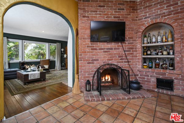 Fireplace, Interior, Living room, Recessed Lighting, Stone Walls, Wood Texture Flooring