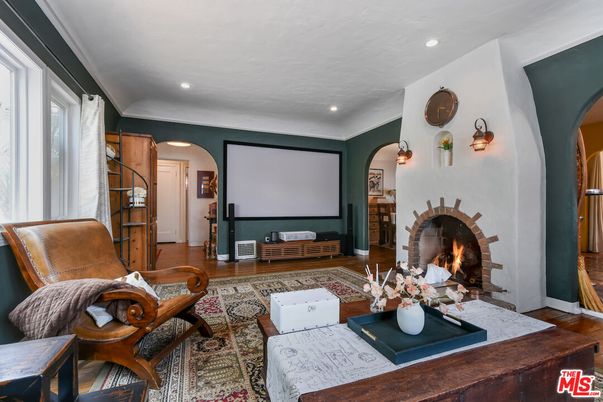 Fireplace, Interior, Living room, Projection Screen, Recessed Lighting, Wood Texture Flooring