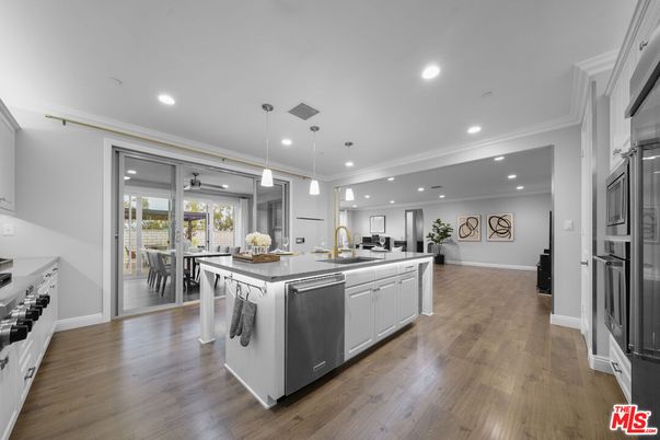 Dining room, Interior, Kitchen, Pendant Lights, Recessed Lighting, Stainless Steel Appliances, Wood Texture Flooring