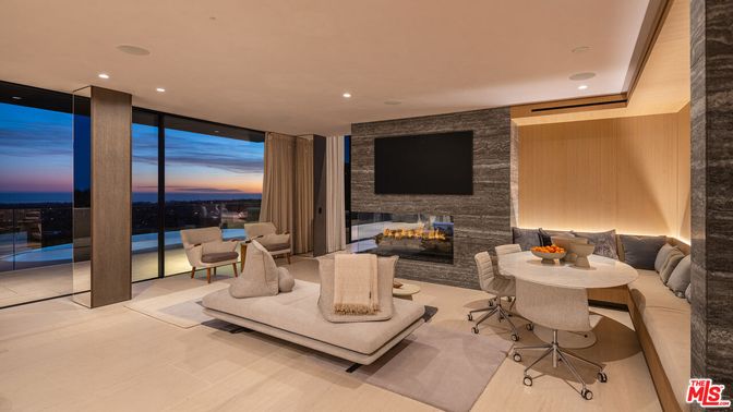 Fireplace, Interior, Living room, Recessed Lighting, Stone Walls, Water, Wood Texture Flooring