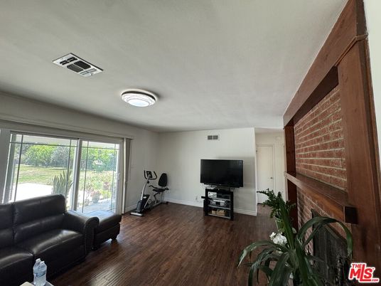 Fireplace, Fitness Equipment, Interior, Stone Walls, Wood Texture Flooring