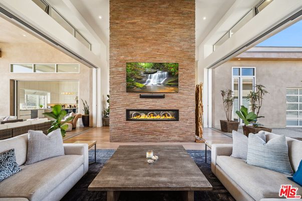 Fireplace, Interior, Living room, Recessed Lighting, Stone Walls, Wood Texture Flooring