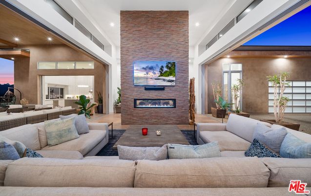 Fireplace, Interior, Living room, Recessed Lighting, Stone Walls, Wood Texture Flooring