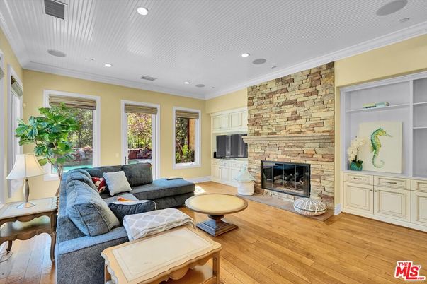 Fireplace, Interior, Living room, Recessed Lighting, Stone Walls, Wood Texture Flooring