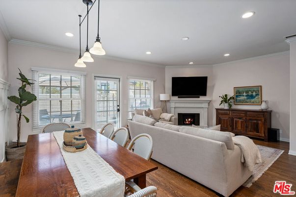Dining room, Fireplace, Interior, Living room, Pendant Lights, Recessed Lighting, Wood Texture Flooring