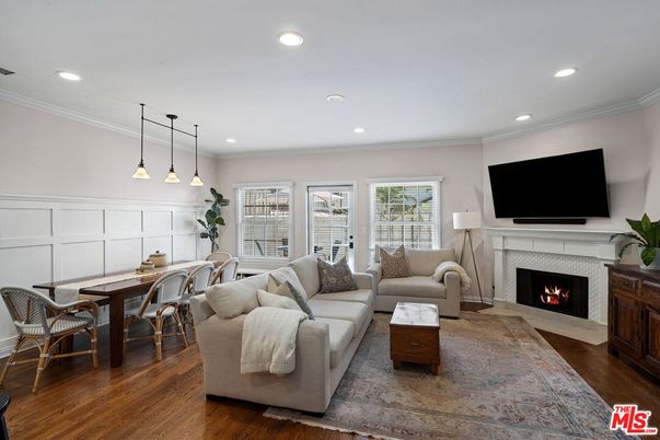 Dining room, Fireplace, Interior, Living room, Pendant Lights, Recessed Lighting, Wood Texture Flooring