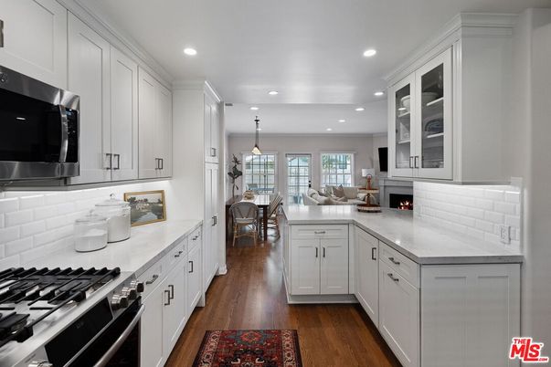 Dining room, Fireplace, Interior, Kitchen, Living room, Pendant Lights, Recessed Lighting, Stainless Steel Appliances, Wood Texture Flooring