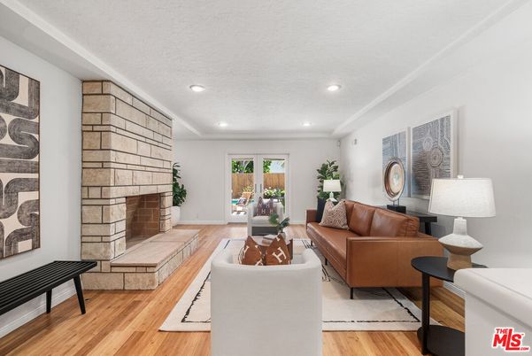 Fireplace, Interior, Living room, Recessed Lighting, Stone Walls, Wood Texture Flooring