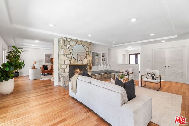 Fireplace, Interior, Living room, Recessed Lighting, Stone Walls, Wood Texture Flooring