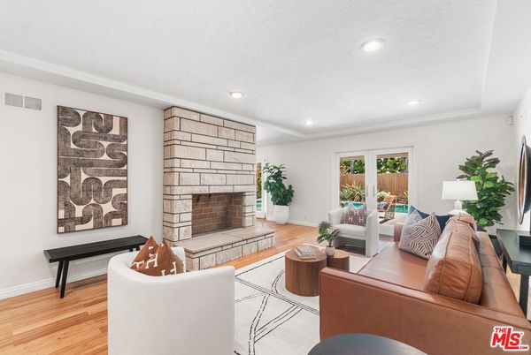 Fireplace, Interior, Living room, Recessed Lighting, Stone Walls, Wood Texture Flooring