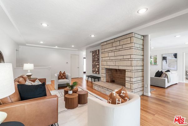Fireplace, Interior, Living room, Recessed Lighting, Stone Walls, Wood Texture Flooring