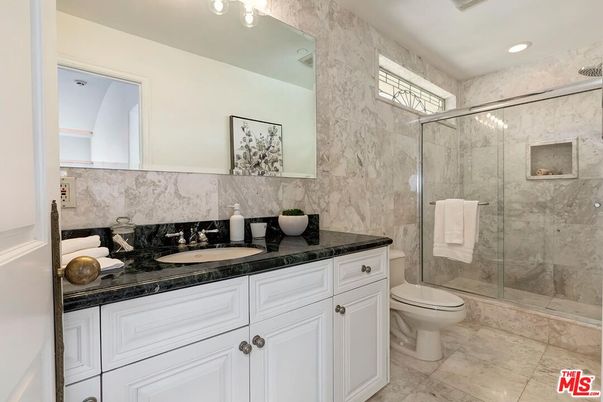 Bathroom, Dual Sink Vanities, Glass Shower, Interior, Marble Walls, Recessed Lighting