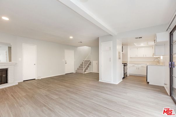 Empty room, Fireplace, Interior, Kitchen, Recessed Lighting, Wood Texture Flooring