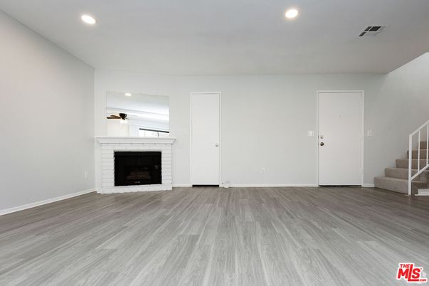 Empty room, Fireplace, Interior, Recessed Lighting, Wood Texture Flooring