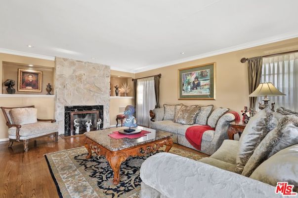 Fireplace, Interior, Living room, Recessed Lighting, Stone Walls, Wood Texture Flooring