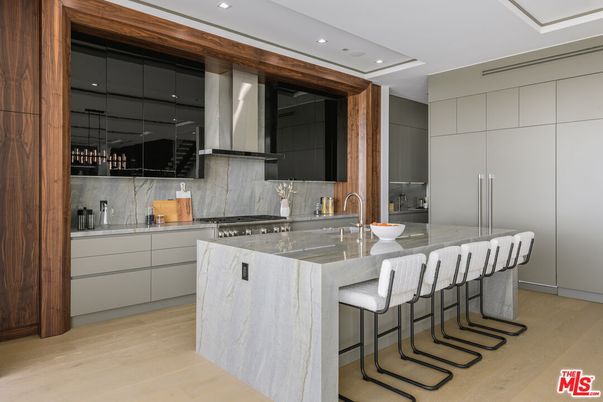 Interior, Kitchen, Marble Walls, Recessed Lighting, Stainless Steel Appliances, Wood Texture Flooring