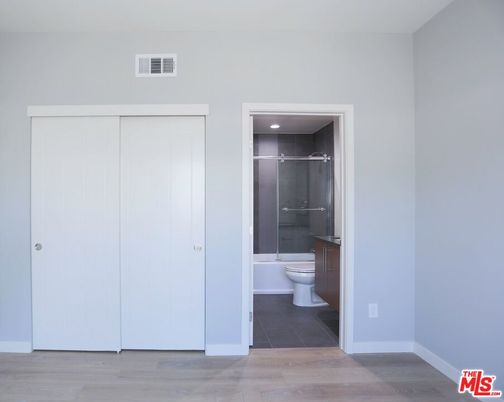 Bathroom, Glass Shower, Interior, Recessed Lighting, Wood Texture Flooring