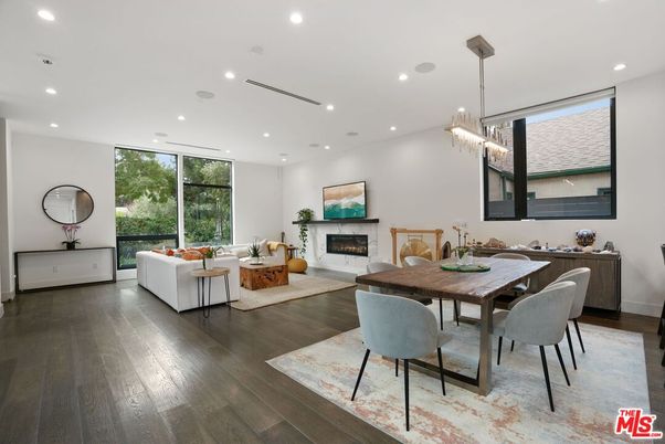 Chandelier, Dining room, Fireplace, Interior, Living room, Pendant Lights, Recessed Lighting, Wood Texture Flooring