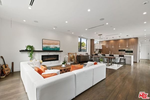 Dining room, Fireplace, Interior, Kitchen, Living room, Pendant Lights, Recessed Lighting, Stainless Steel Appliances, Wood Texture Flooring