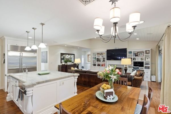 Chandelier, Dining room, Fireplace, Interior, Kitchen, Living room, Pendant Lights, Recessed Lighting, Stainless Steel Appliances, Wood Texture Flooring