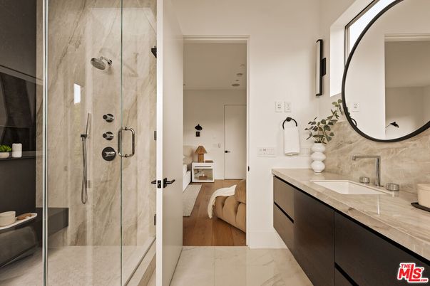 Bathroom, Dual Sink Vanities, Glass Shower, Interior, Marble, Wood Texture Flooring