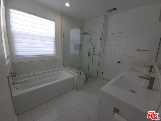 Bathroom, Dual Sink Vanities, Glass Shower, Interior, Marble, Marble Walls, Recessed Lighting