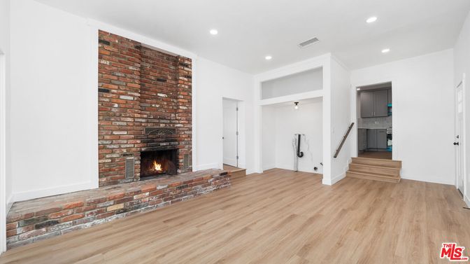 Empty room, Fireplace, Interior, Recessed Lighting, Stone Walls, Wood Texture Flooring