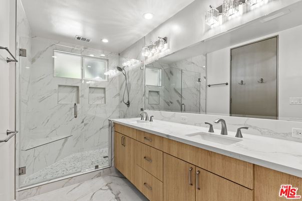 Bathroom, Dual Sink Vanities, Glass Shower, Interior, Marble, Marble Walls, Recessed Lighting
