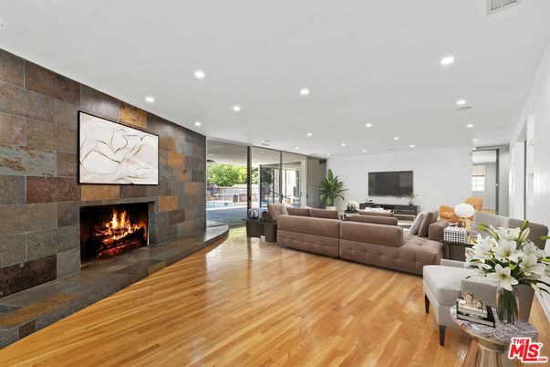 Fireplace, Interior, Living room, Recessed Lighting, Stone Walls, Wood Texture Flooring