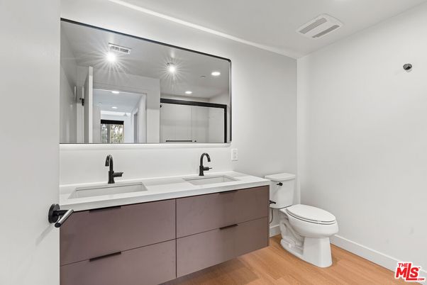 Bathroom, Dual Sink Vanities, Interior, Recessed Lighting, Wood Texture Flooring