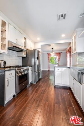 Chandelier, Interior, Kitchen, Pendant Lights, Recessed Lighting, Stainless Steel Appliances, Wood Texture Flooring