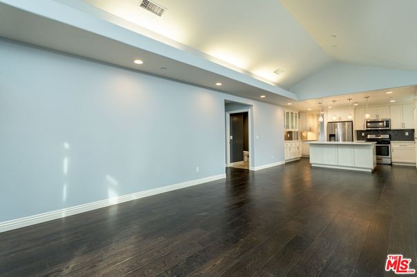 Empty room, Interior, Kitchen, Pendant Lights, Recessed Lighting, Stainless Steel Appliances, Wood Texture Flooring