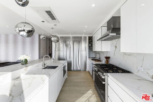 Interior, Kitchen, Marble Walls, Pendant Lights, Recessed Lighting, Stainless Steel Appliances, Wood Texture Flooring