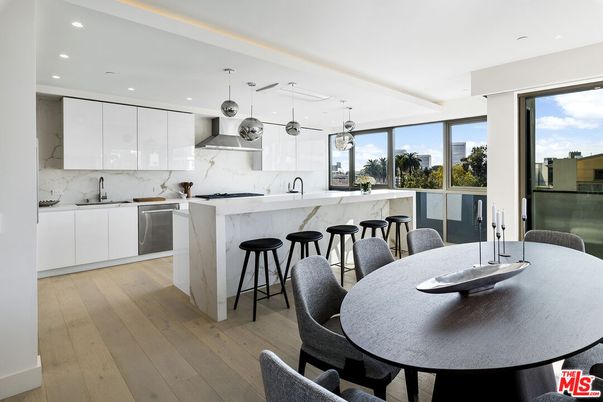 Dining room, Interior, Kitchen, Marble Walls, Pendant Lights, Recessed Lighting, Stainless Steel Appliances, Wood Texture Flooring