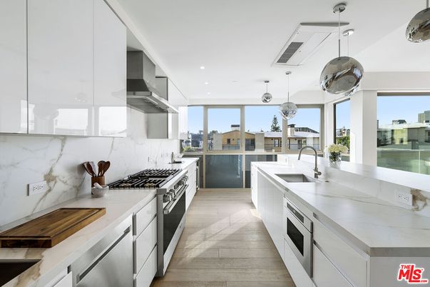 Interior, Kitchen, Marble Walls, Pendant Lights, Recessed Lighting, Stainless Steel Appliances, Wood Texture Flooring